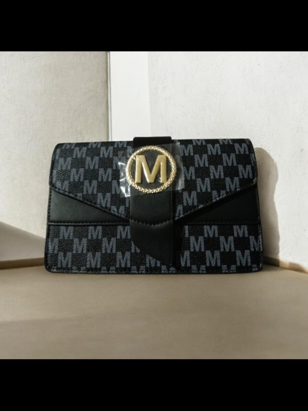 Black Monogram Clutch with Gold 'M' Medallion